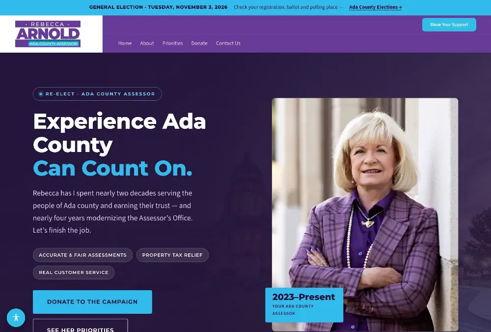 Smiling woman with blonde hair in a purple plaid blazer and pearls, arms crossed, beside a campaign website hero.