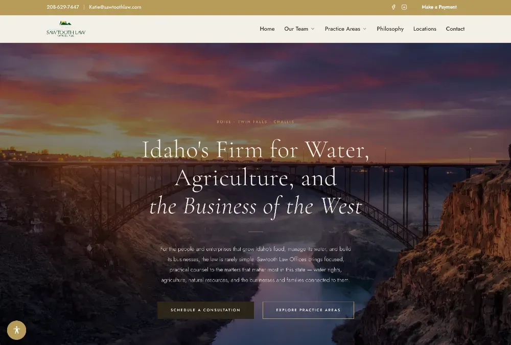 Website hero banner over a sunset canyon with an arched steel bridge, promoting Idaho water and agriculture law.