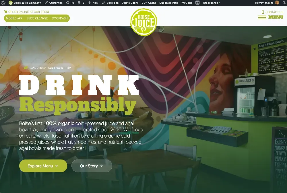 Boise Juice Co. storefront hero with bold DRINK Responsibly headline over a colorful mural and juice bar counter.