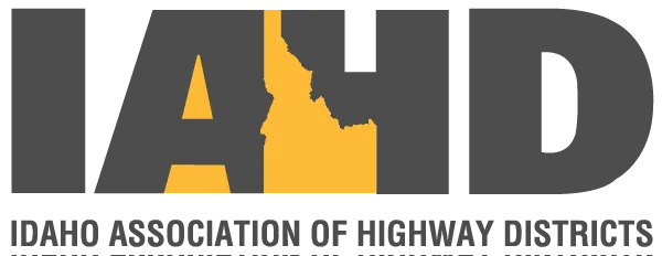 Logo of the Idaho Association of Highway Districts with large gray letters IAHD and a gold Idaho state outline.